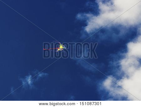 Colorful kite flying in the blue sky