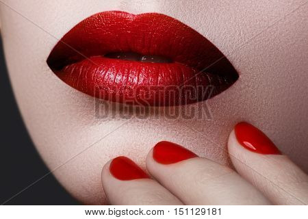 Red Sexy Lips And Nails Closeup. Open Mouth. Manicure And Makeup