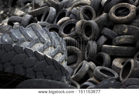 Huge heap of used garbage tyre outdoor
