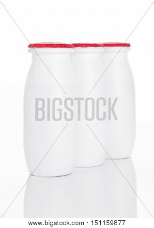 Yogurt containers healthy vitamin drink on white background