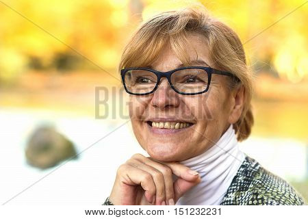 Portrait of mature attractive woman with blond hair
