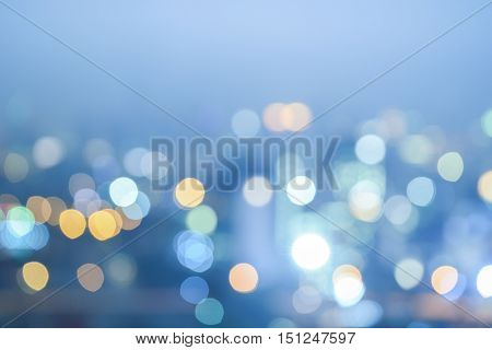 Abstract colorful blur bokeh night city life in vintage cool tone blurry view of urban street lights background