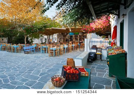 FOLEGANDROS, GREECE - SEPTEMBER 24, 2016: Restaurants and a shop in the main square of Folegandros village on September 24.