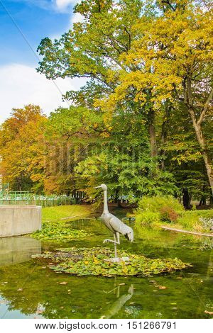 The crane bird statue in beautiful public park in Daruvar, Croatia, in autumn