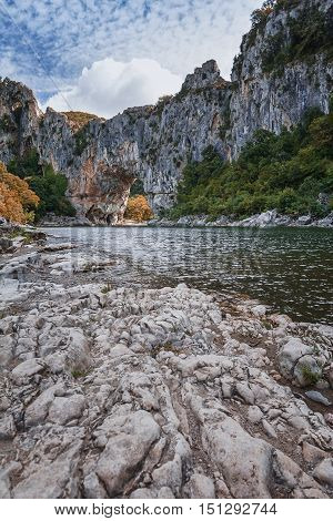 The Pont d'Arc is a large natural bridge located in the Ardèche département in the south of Franc. The arch carved out by the Ardèche River is 60 m wide and 54 m high.