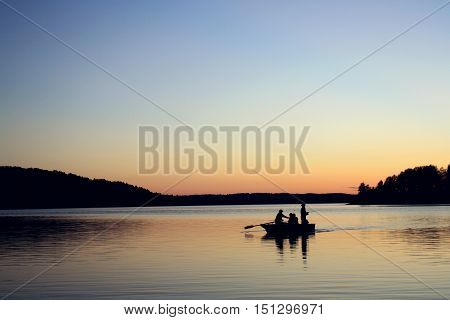Evening Fishing At The Lake. Boat With Fishermen.
