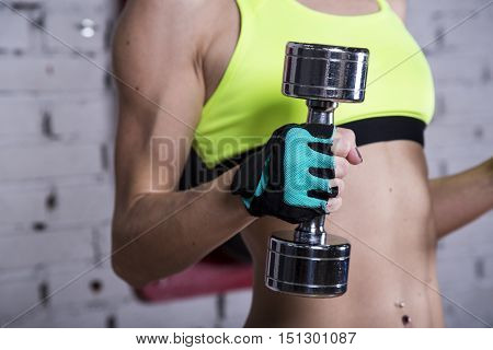 Young Woman Goes In For Sports At Gym