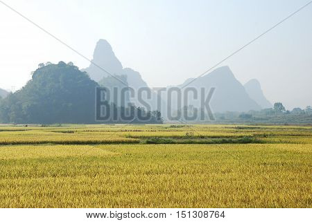 The karst mountains and rural scenery in autumn