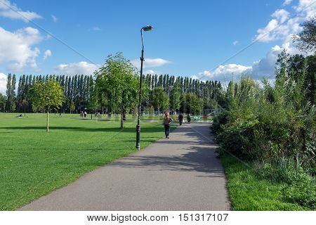 Caversham, Reading/UK. 2nd October 2016. The green and open Christchurch Meadows in Caversham on a warm, late summer's day with people wandering through the park.