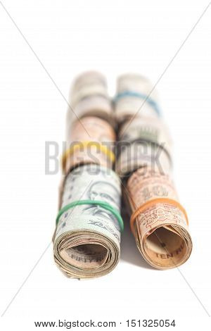 Rolls of Indian rupees isolated on white