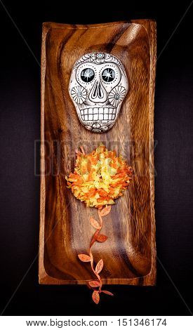 Sugar skull altar for "Dia de los Muertos" celebration over black background