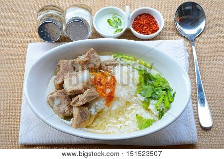 boiled rice with pork rib hot soup on bowl
