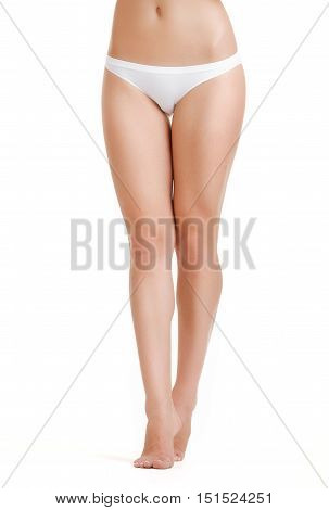Legs-body part. Slim female legs on a white background. Beautiful female body isolated on white. Beautiful Woman. Perfect Body. Slim legs young woman in lingerie. Diet, healthy lifestyle.