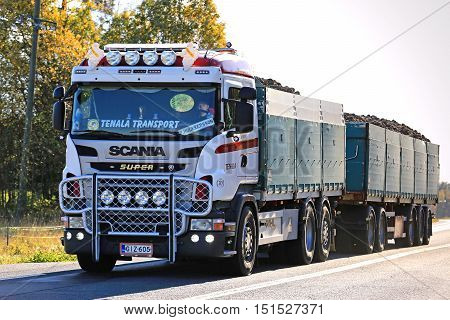 SALO, FINLAND - OCTOBER 8, 2016: Customized Scania truck with bull bar and lighting accessories of MHL-Trans hauls sugar beet along highway to the sugar factory in Sakyla Finland.