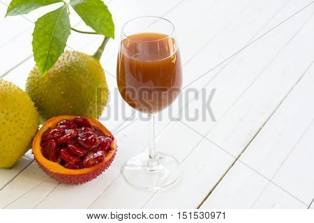 Cochinchin Gourd and Cochinchin Gourd  slice on wooden white background.fruit for health and stillife.