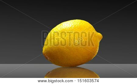 Citrus ripe lemon on abstract dark background.