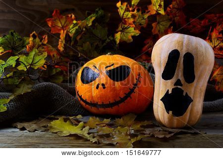 Halloween Stingy Jack pumpkins on dark rustic background. Halloween symbol jack-o-lantern background. Halloween decoration.