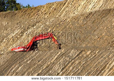 Red Digger In Stone-pit