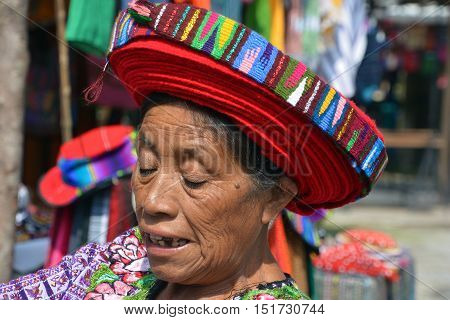 SANTIAGO DE ATITLAN GUATEMALA APRIL 29 2016: Tzutujil woman wearing a traditional toyocal hat. The Mayan people still make up a majority of the population in Guatemala,