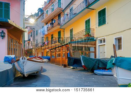 The old, narrow street in the medieval Italian village of Manarola at night. Parco Nazionale delle Cinque Terre, Liguria, Italy.