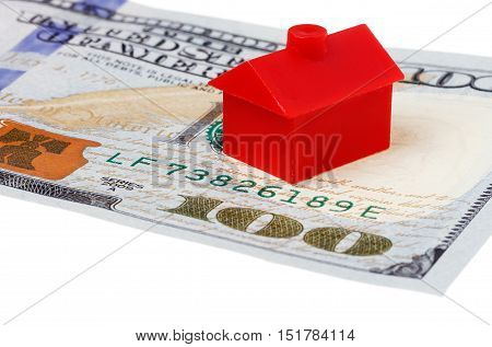 Close-up of red building on a 100 US dollar banknote isolated on white background.