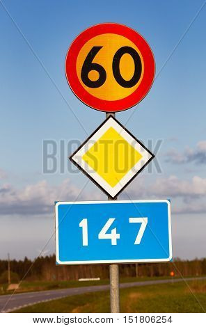 Signs for speed limit 60 kmh primary road and road number 147 in the Swedish province of Gotland.