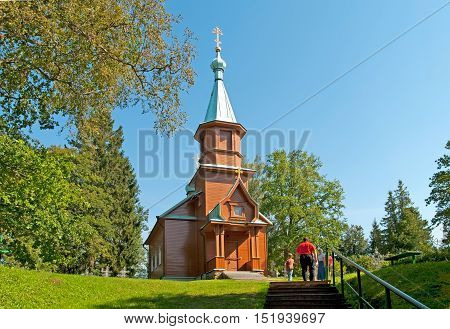 KUREMAE, IDA-VIRUMAA COUNTY, ESTONIA - AUGUST 21, 2016: Church of St Arsinius and St Nicholas on the monastery cemetery. Puhtitsa Dormition Convent. The Estonian Orthodox Church of Moscow Patriarchate