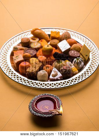 Mix Mithai and diya on diwali festival