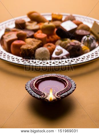 Mix Mithai and diya on diwali festival