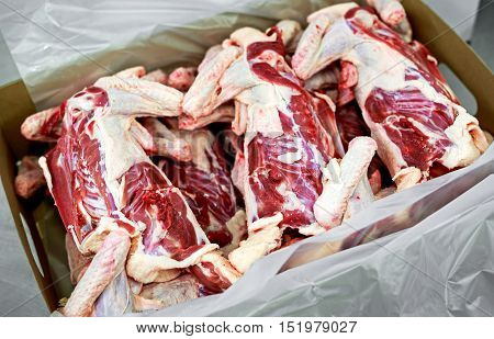 Raw meat, skin duck carcass in box. selected focus.