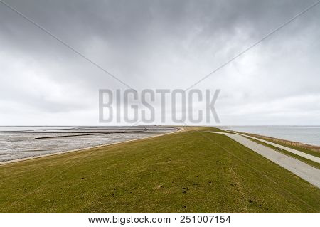 Empty Dike With Cloudy Sky Near Nordstrand, Schleswig-holstein, Germany
