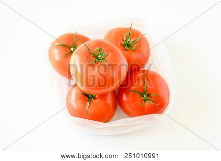 Freshness Top View Of Tomatoes Put In Plastic Bag On White Background And Vegetable Full With Nutrit