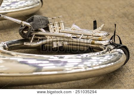 A Sousaphone On The Floor Wearing A Cap