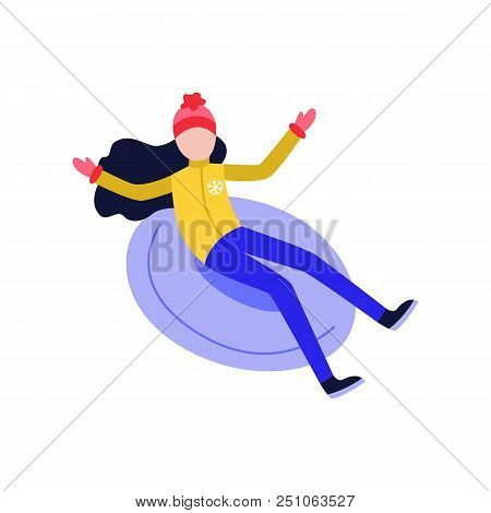 Flat Girl In Hat Sledging At Inflatable Tube, Snowtubing Outdoors In Winter In Warm Clothing And Lon