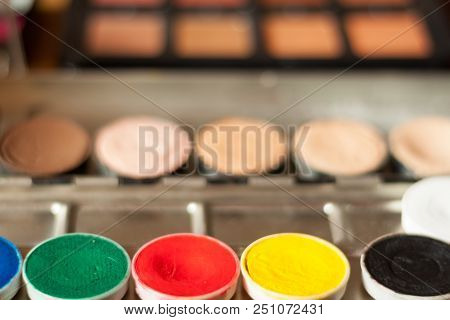 Blurry Professional Visagiste Workspace. Makeup Tools. Creative Mess