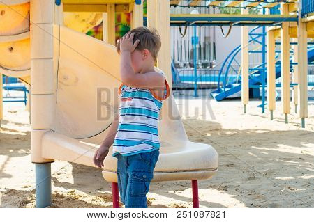 Children Ride On A Children's Roller Coaster In The Park.