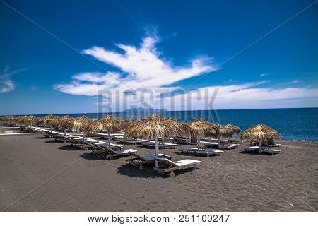 Permissa black sand beach in Santorini. Greece. 