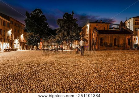 Ferrara, Italy - July, 23, 2018: street in the historical center of Ferrara at a night