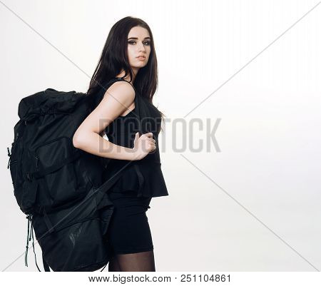 Girl Classic Black Dress And Touristic Backpack Equipment. Elegance And Capaciousness. Woman Carry B