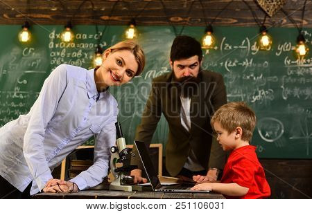 Tutor Asks The Tutee To Find The Definition In The Textbook, Happy Teacher In Classroom, Home Tutor 