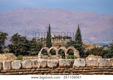 Mosque On A Hill With Mountains In The Background On A Sunny Day At Anjar, Bekaa Valley, Lebanon
