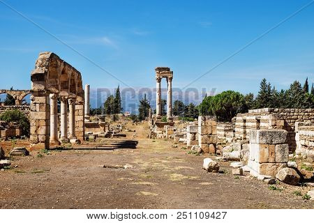 Columns In Umayyad City Ruins In Anjar With Mountains, Bekaa Valley, Lebanon