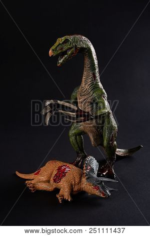 Nothronychus With A Triceratops Body Nearby On Dark Background