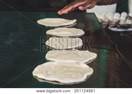 Indian Chapatti On Fire, Pushkar, India Close Up. Fried Tortillas On A Hot Baking Sheet. Street Food