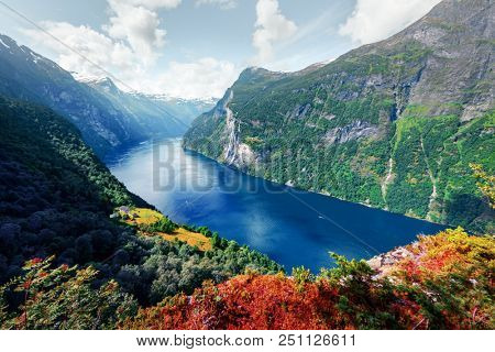 Breathtaking view of Sunnylvsfjorden fjord and famous Seven Sisters waterfalls, near Geiranger village in western Norway.