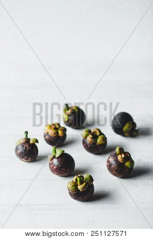 Natural Mangosteen On White Wood Natural Mangosteen On White Wood