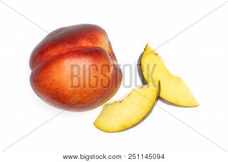 Group Of One Whole Two Slices Of Ripe Deep Red Nectarine Flatlay Isolated On White