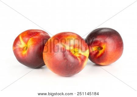 Group Of Three Whole Ripe Deep Red Nectarine Set Isolated On White