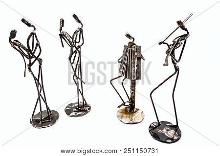 Figures Of Music Performers Made With Welded Black Metal Wire. Accordion And Violin Are Playing Toge