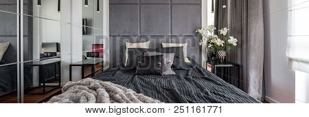 Luxurious Bedroom With Bed, Upholstered Wall And Mirror, Panorama